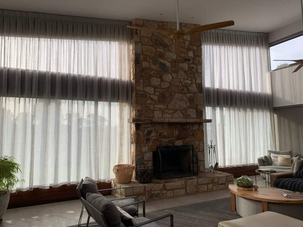 Brick Home With Sheer Curtains