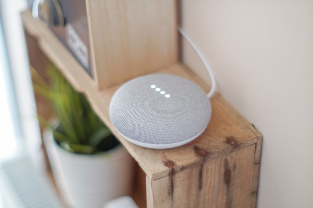 Smart speaker on wooden shelf